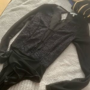 Lacy black body suit with deep V open front
